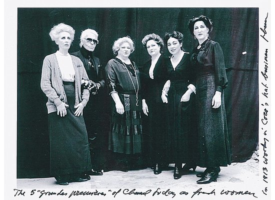 Karl Lagerfeld with Chanel seamstresses costumed as women working in Chanel's hat business in 1913. Karl Lagerfeld with Chanel seamstresses costumed as women working in Chanel's hat business in 1913.