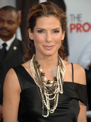 Photo of Sandra Bullock Wearing Alexander McQueen Black Dress and Chunky Necklace at Los Angeles premiere of The Proposal