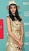 Model Mariacarla Boscono Attends Acapulco Moda Nextel 2009 in Fedora and Gold Dress