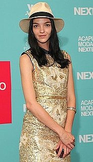 Model Mariacarla Boscono Attends Acapulco Moda Nextel 2009 in Fedora and Gold Dress