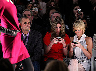 Paris Hilton and Nicky Hilton Text During Fashion Show
