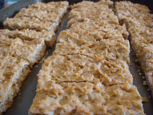Cutting the baked cookies into bars. Cutting the baked cookies into bars.