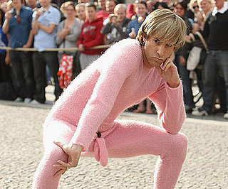 Slide Photo of Sacha Baron Cohen Wearing A Pink Outfit At the German Premiere of Bruno