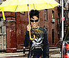 Slide Photo of Rihanna in NYC with a Yellow Umbrella