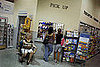 Customers Talk on Their Cell Phones While Getting Prescriptions Filled