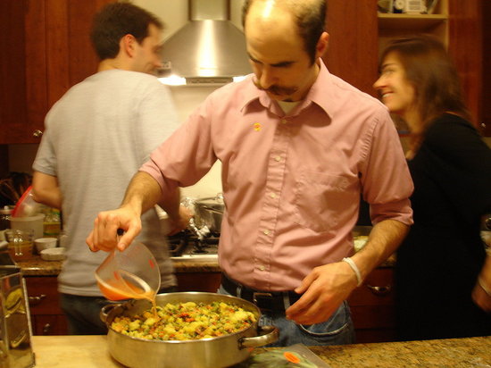 Making the cornbread andoiulle stuffing.