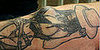 Tattoo Enhanced With Breast Implants